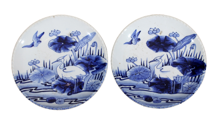 Two pieces of 19th - 20th century Japanese underglazed blue and white plates with bird and lotus decorations.