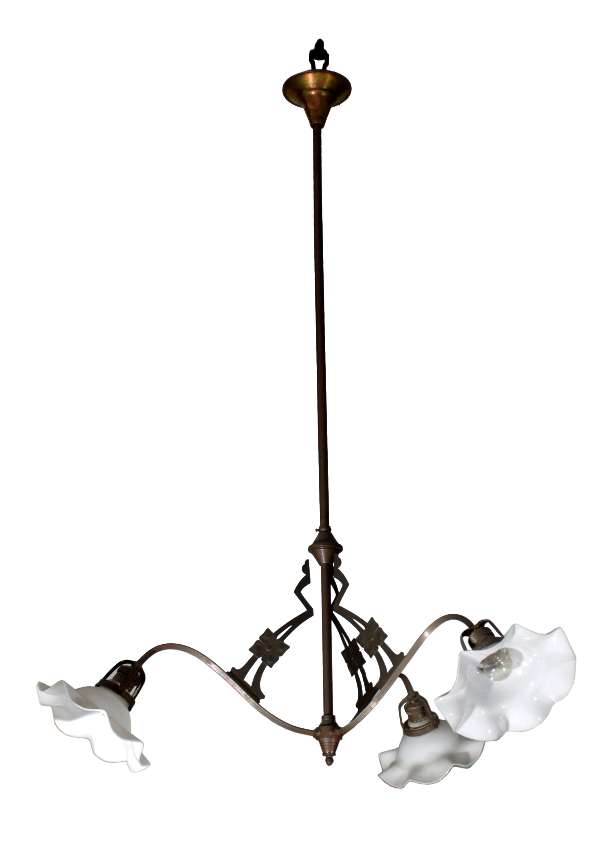 A three arm brass hanging lamps with white glass floral lamp shades.