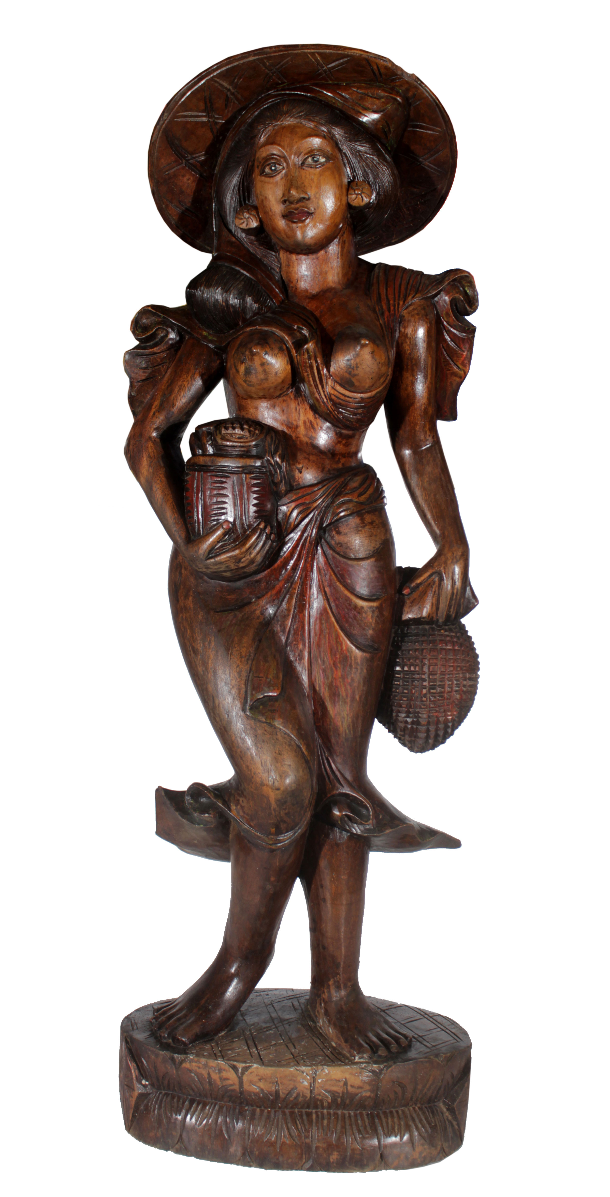 A Balinese wooden sculpture in a figure of a workingwoman.