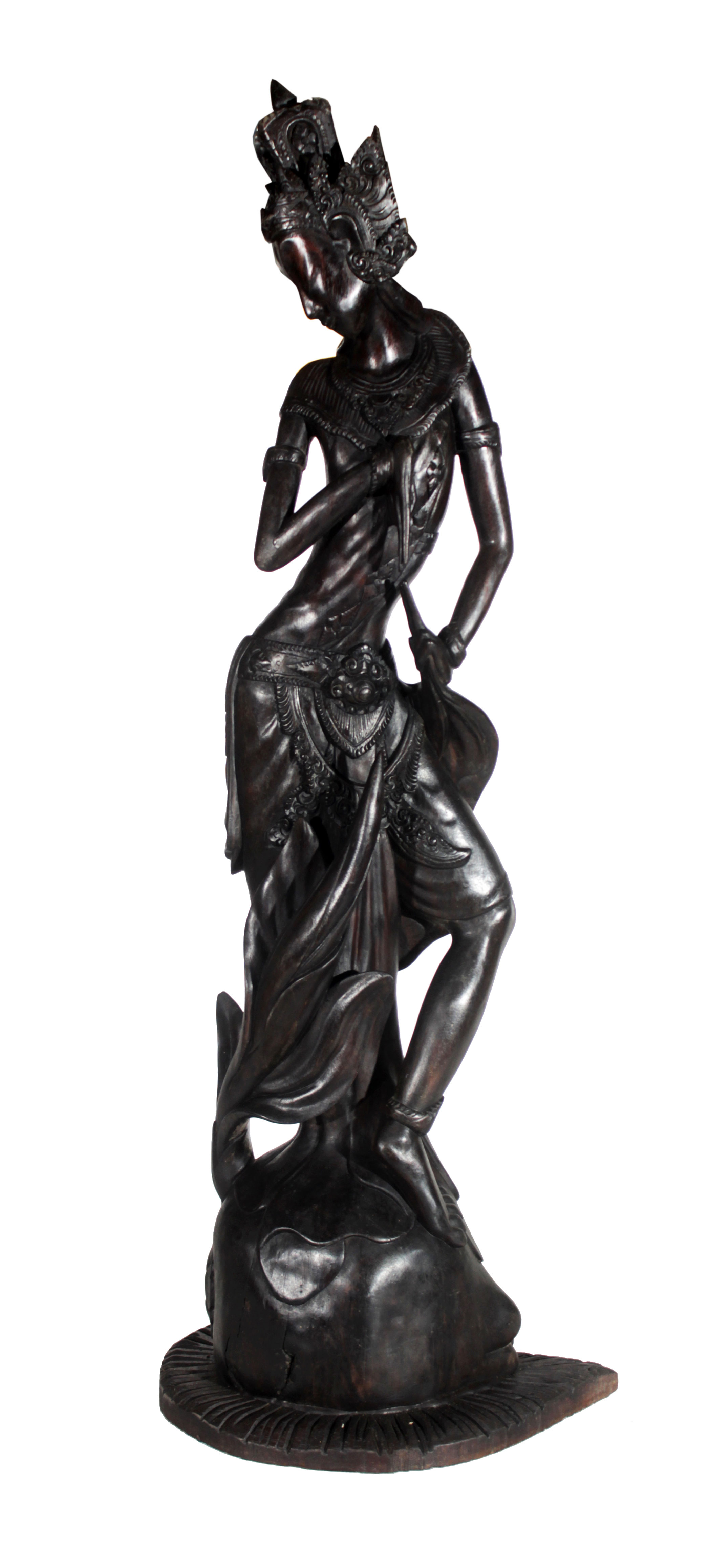 A Balinese carved wooden sculpture of a dancer.