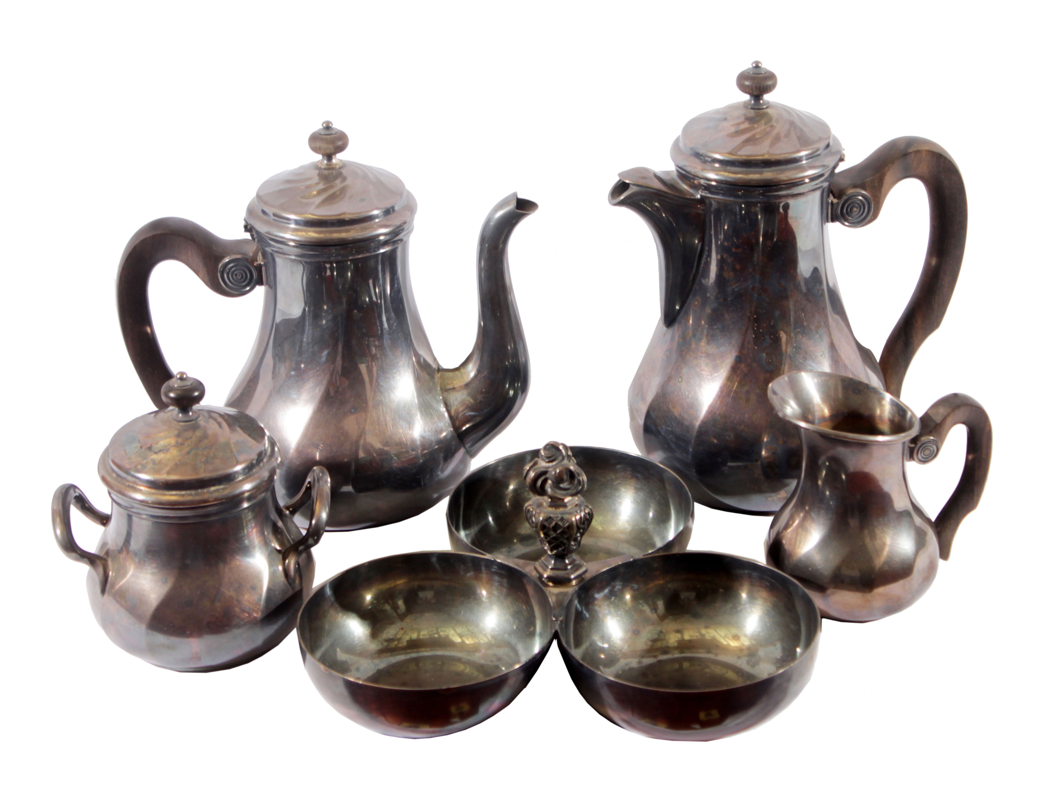 A silverplated tea set consisting of a tea pot, a sugar pot, two additional containers without lids.