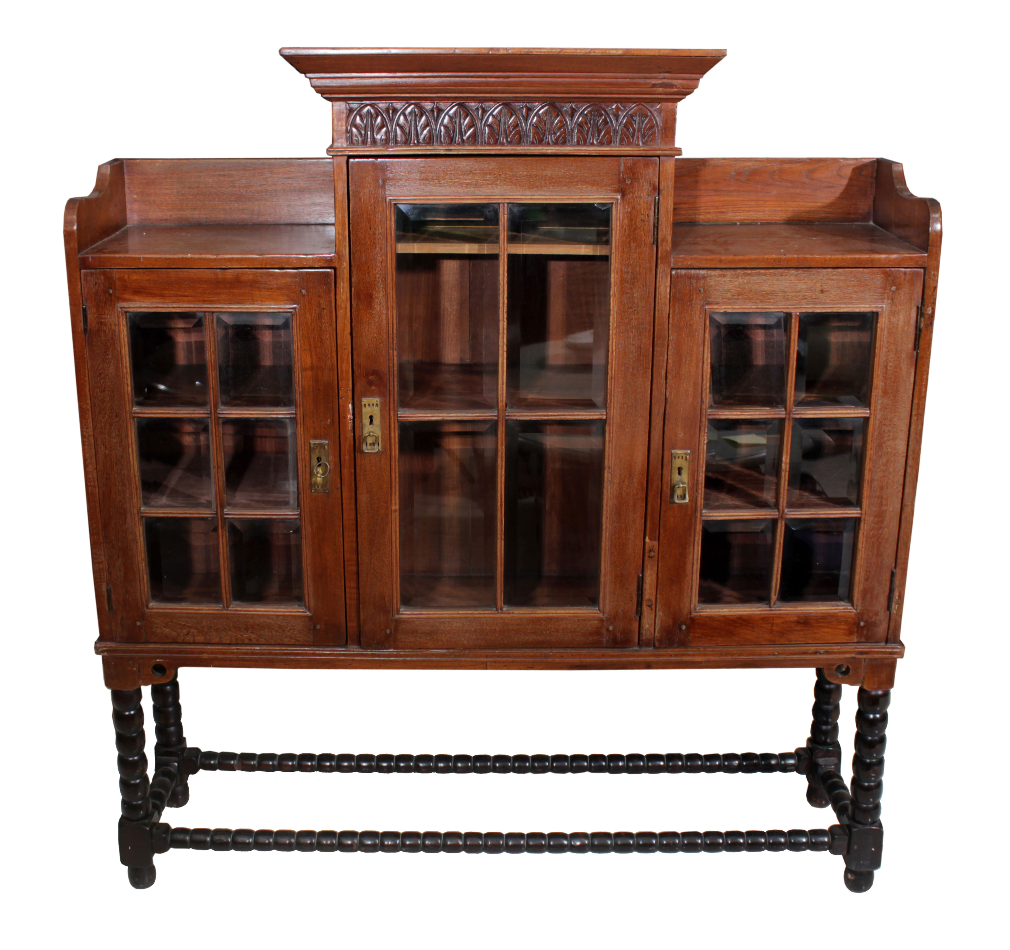 A wooden display cabinet with paneled glass doors.