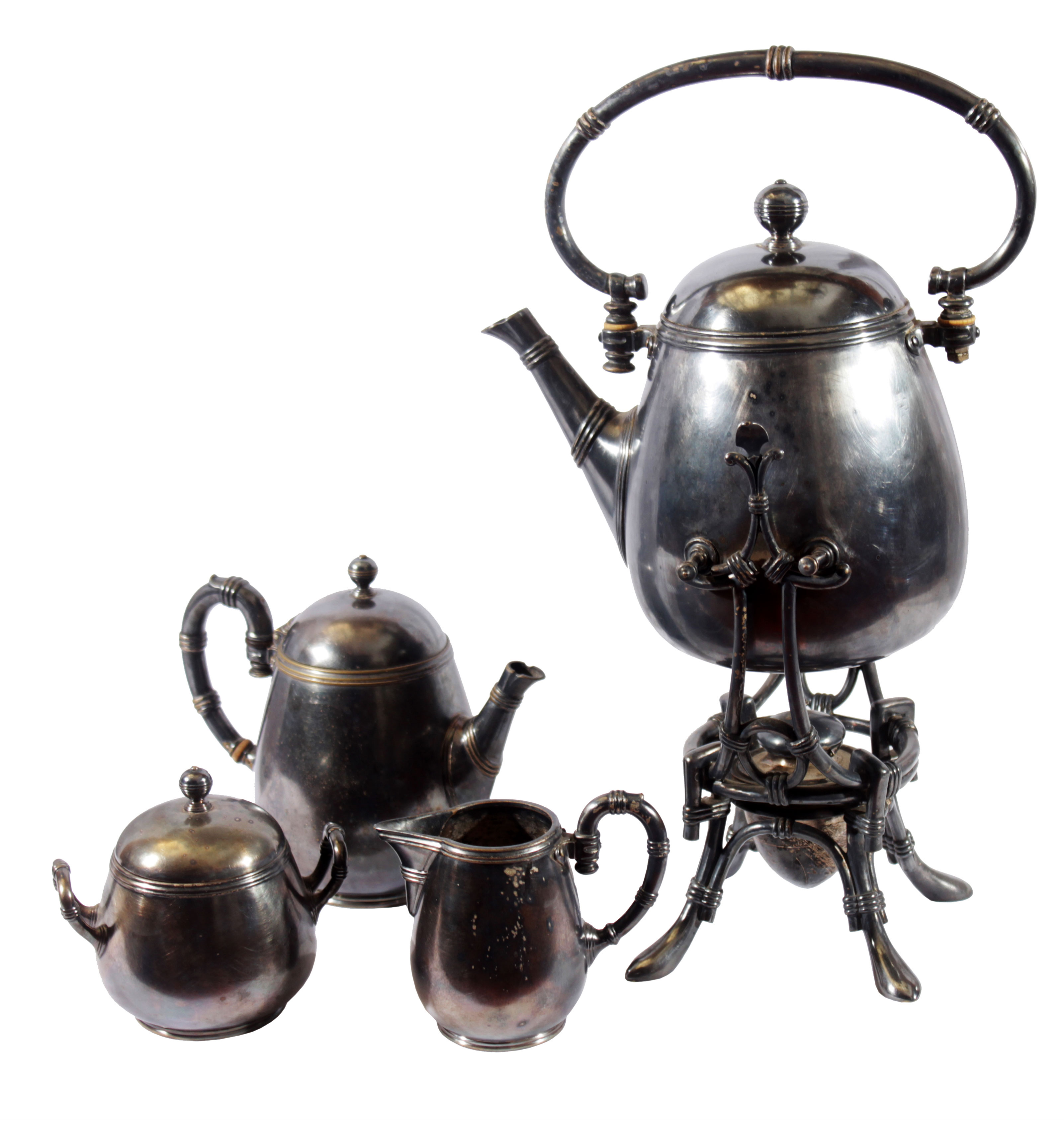 A set of silver plated tea set consisting of a teapot with iron stand, a coffee pot, a sugar pot and a milk pot.