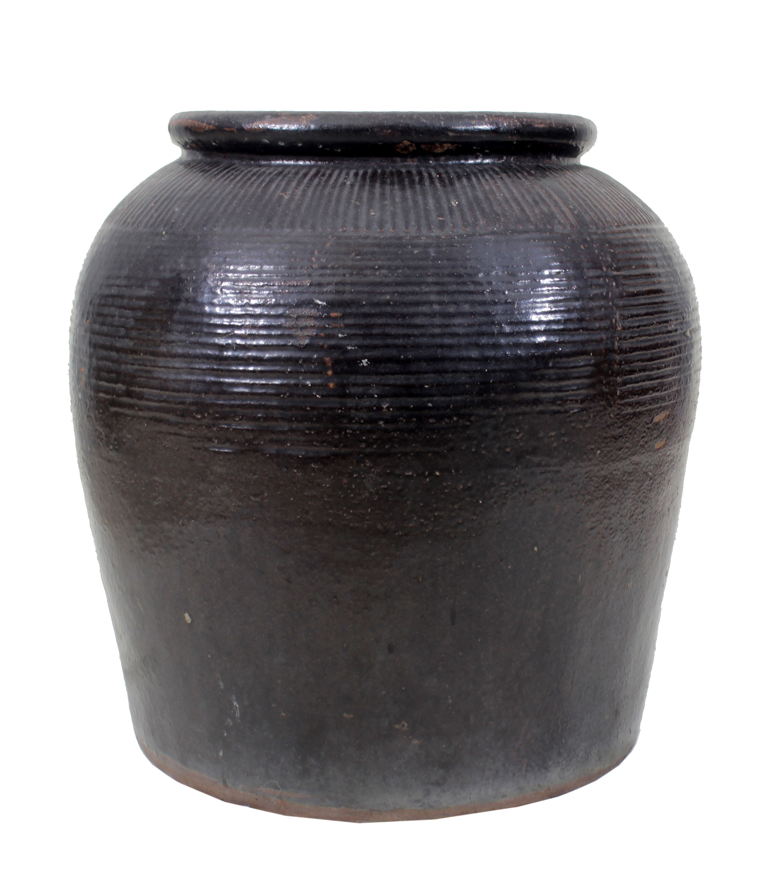 A black glazed storage jar.