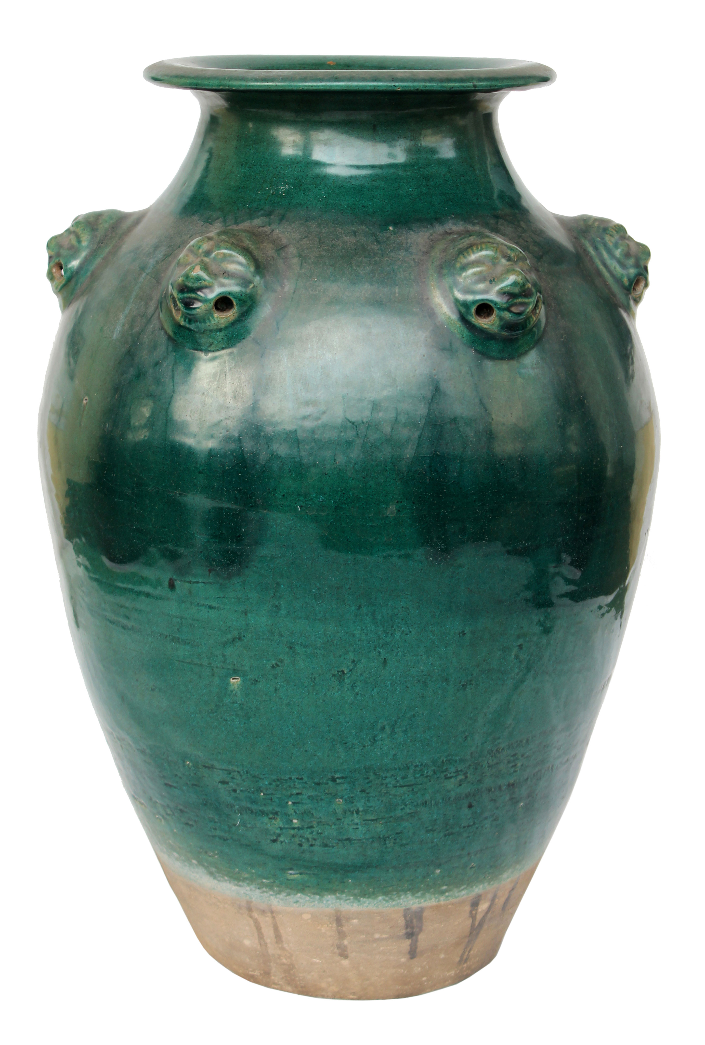 A green-glazed storage jar.