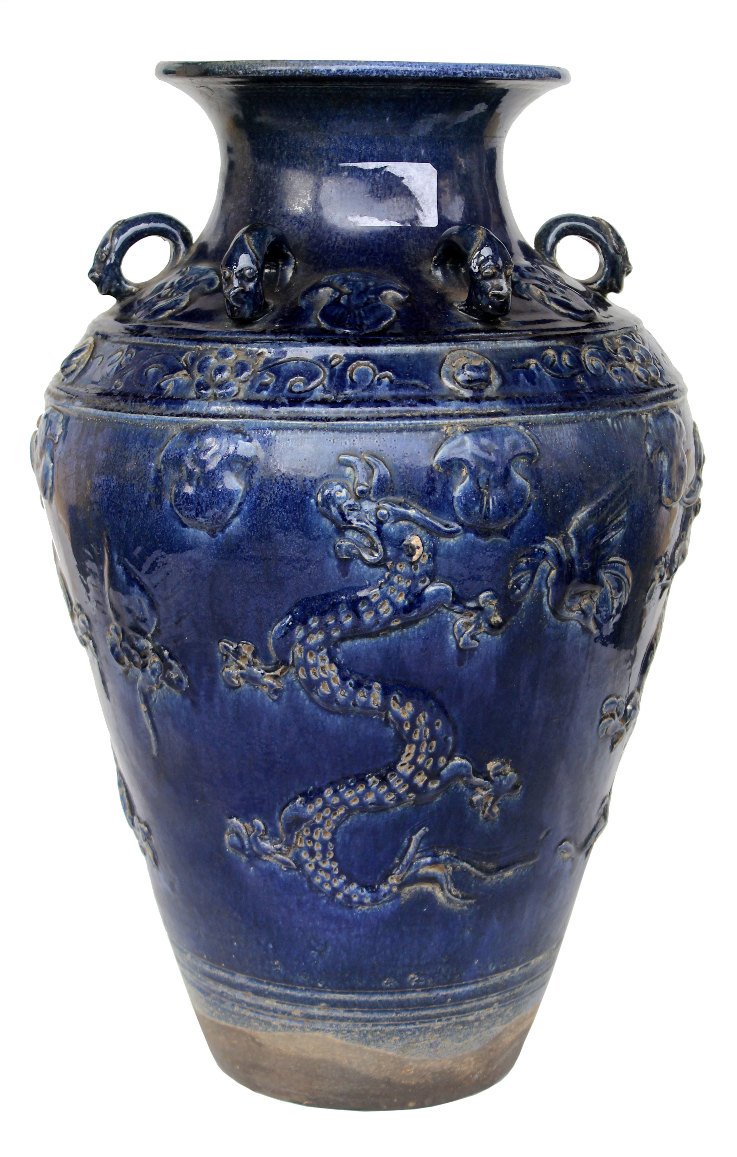 A blue glazed stoneware jar.