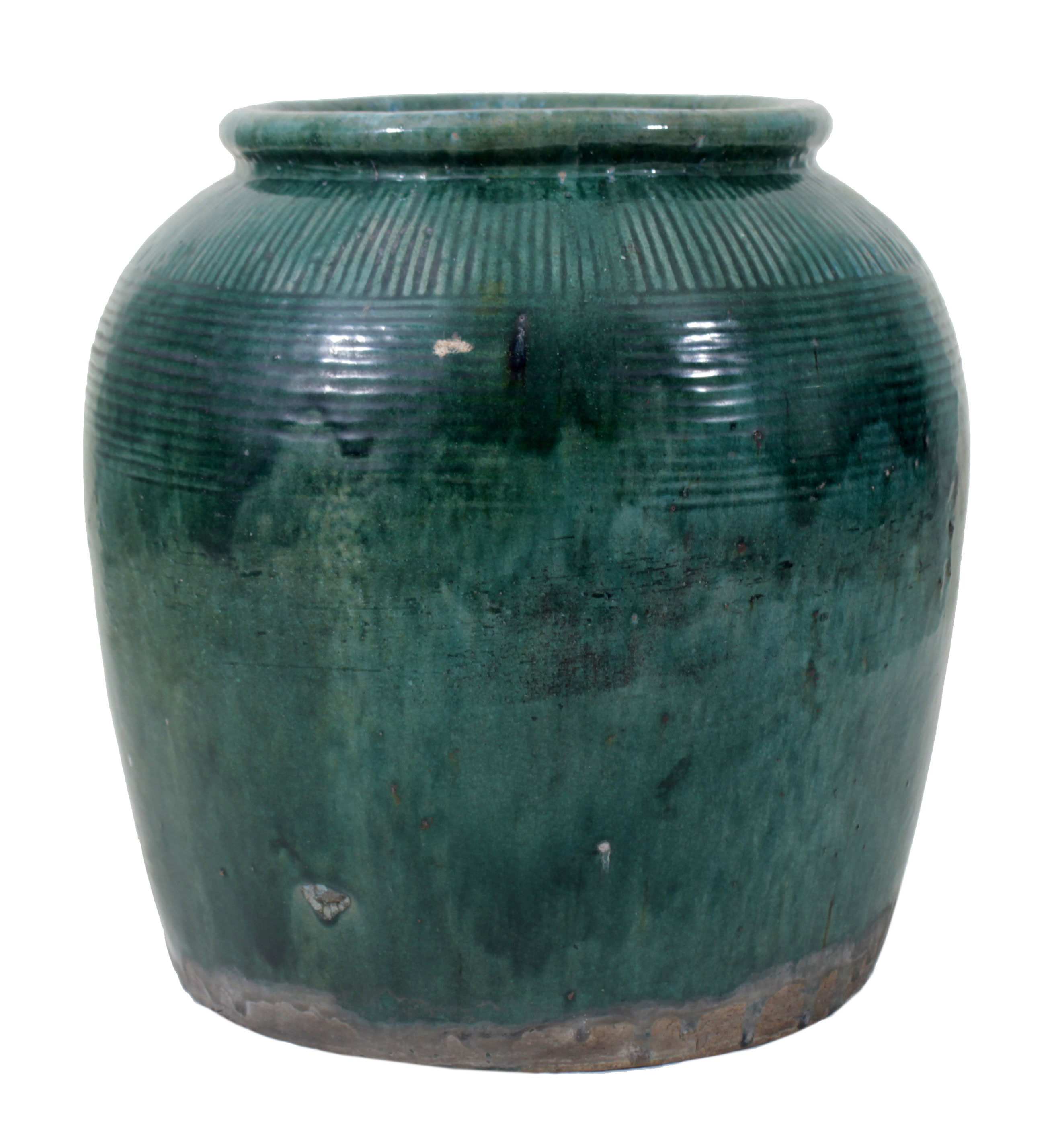 A green glazed stoneware jar.