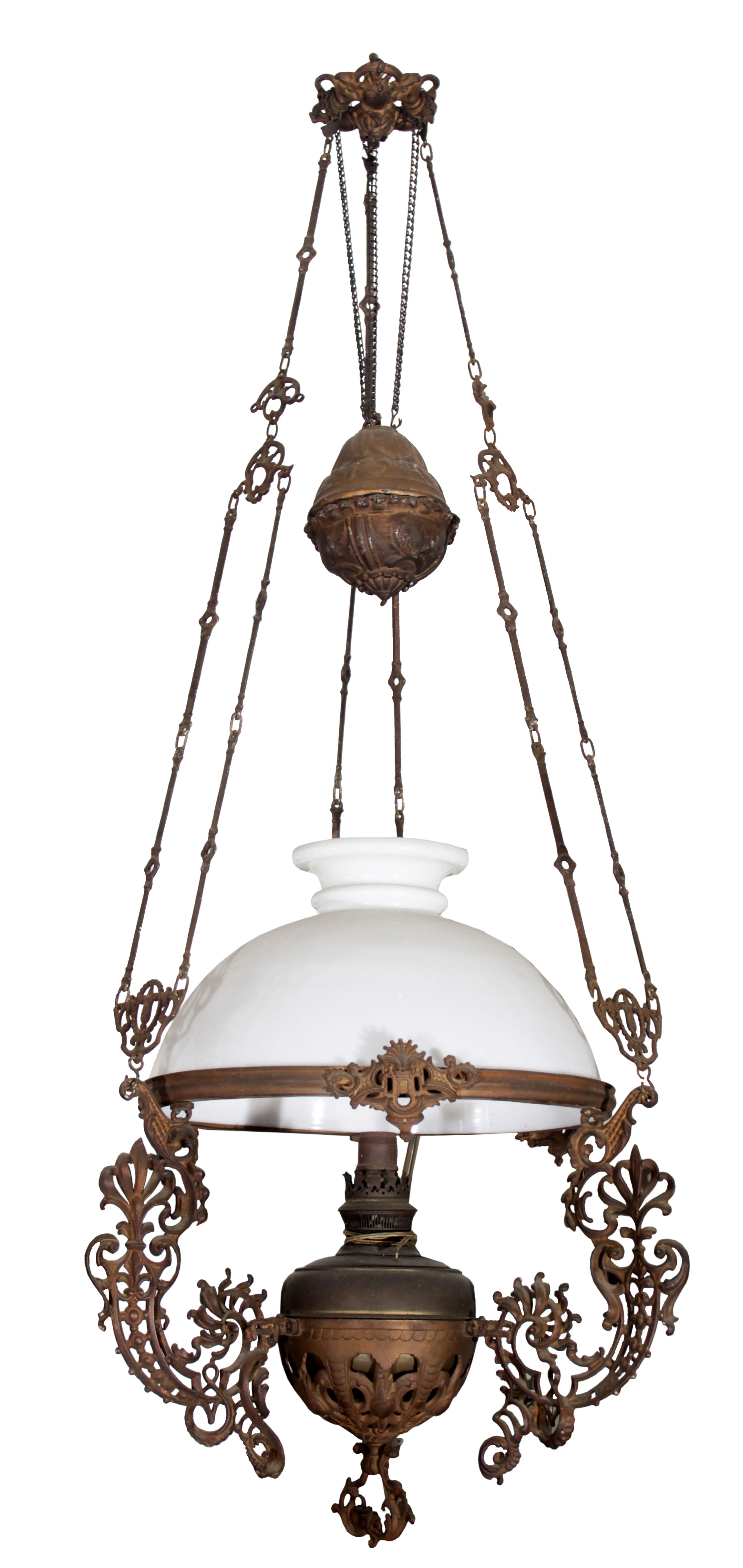 A European hanging oil lamp with metal brackets and a white glass shade.