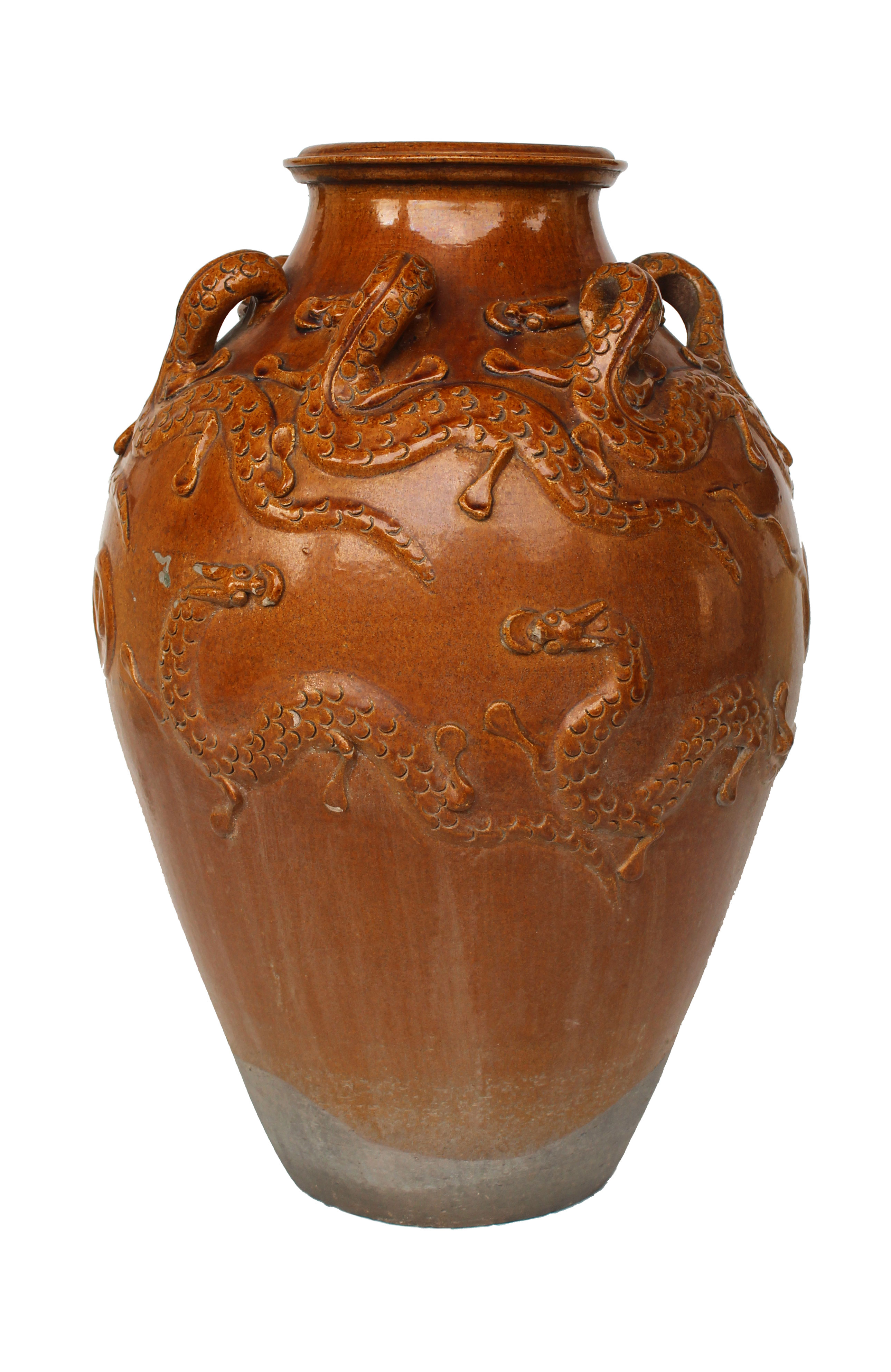 A brown glazed stoneware jar with dragon relief ornament.