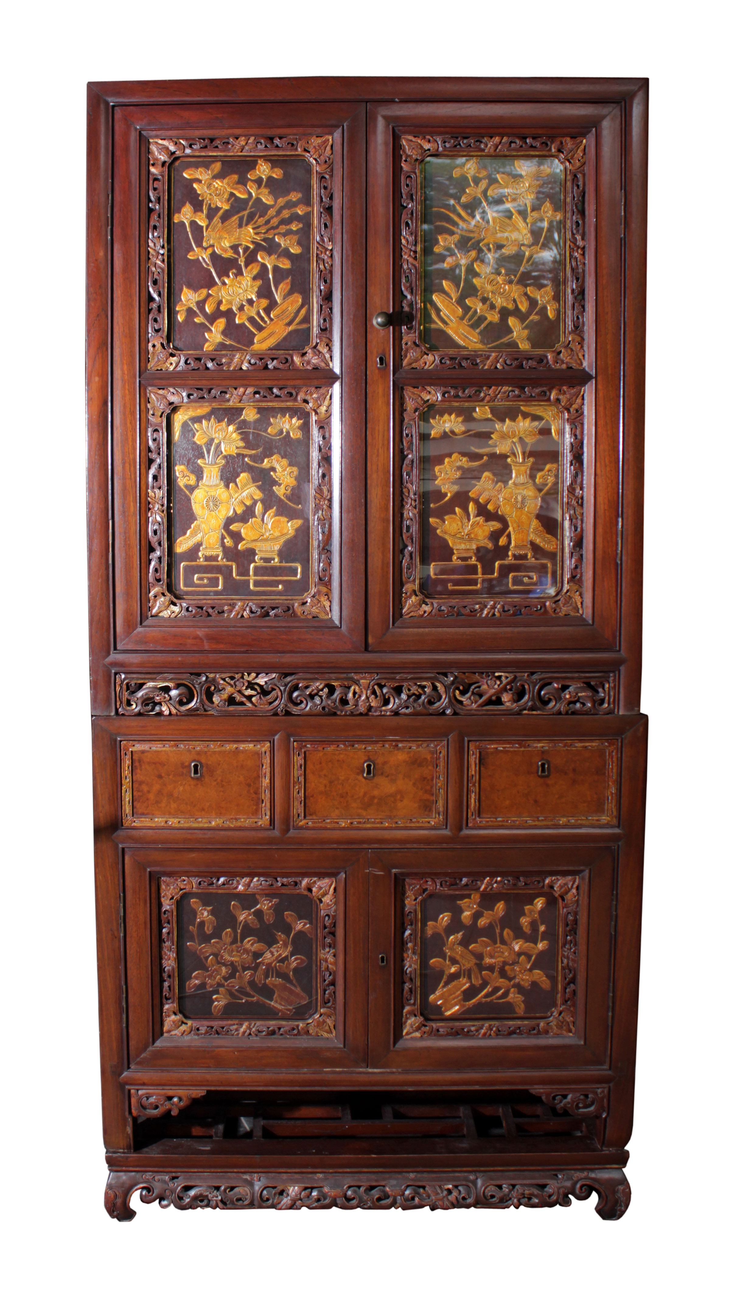 A Chinese Peranakan brown and gold Cuiho tiered cabinet.