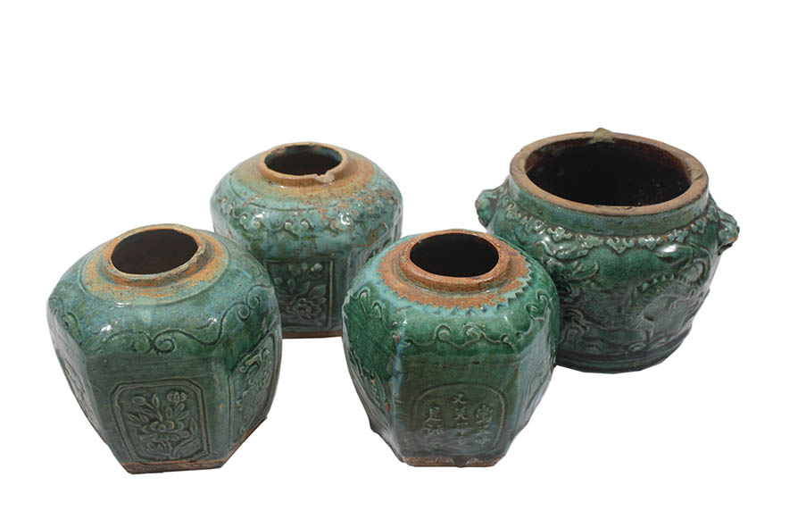 Four late 19th - early 20th century Shiwan green-glazed jars 