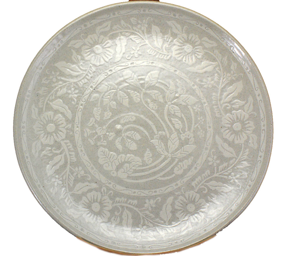 A Pekunden white glazed dish carved with Sgraffito floral motif, Jakarta