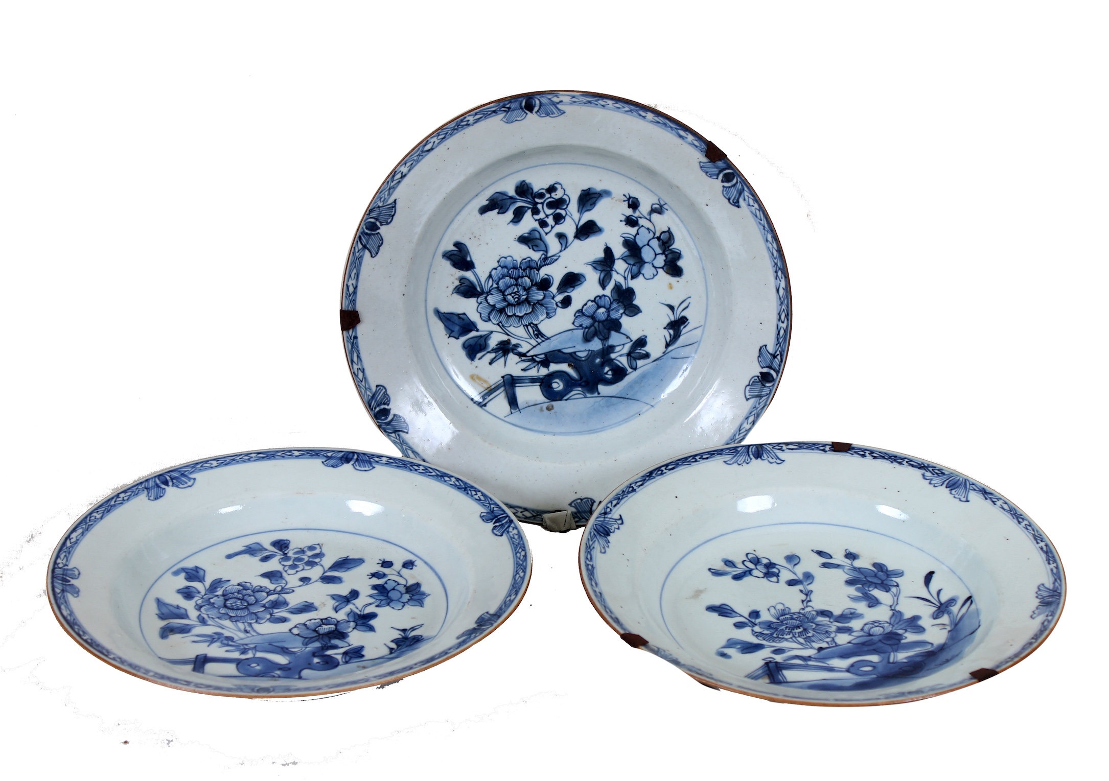 A set of three of 18th century Qing dynasty Chinese blue and white dishes painted with peonies