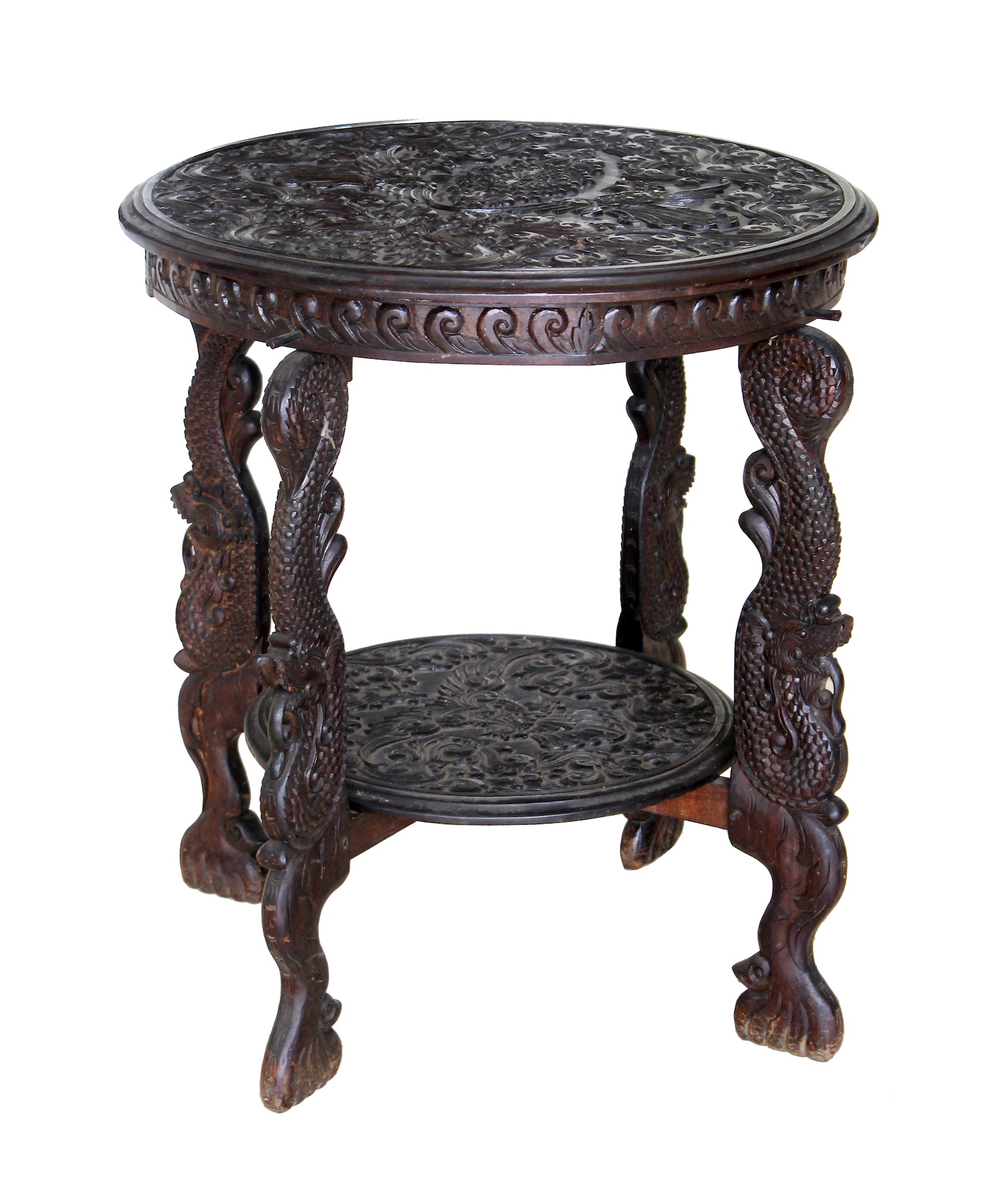 A 20th century carved Javanese teak round table