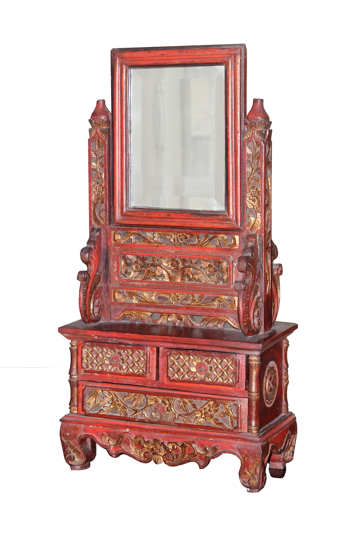 A 19th - early 20th century carved teak red and gold dressing table mirror