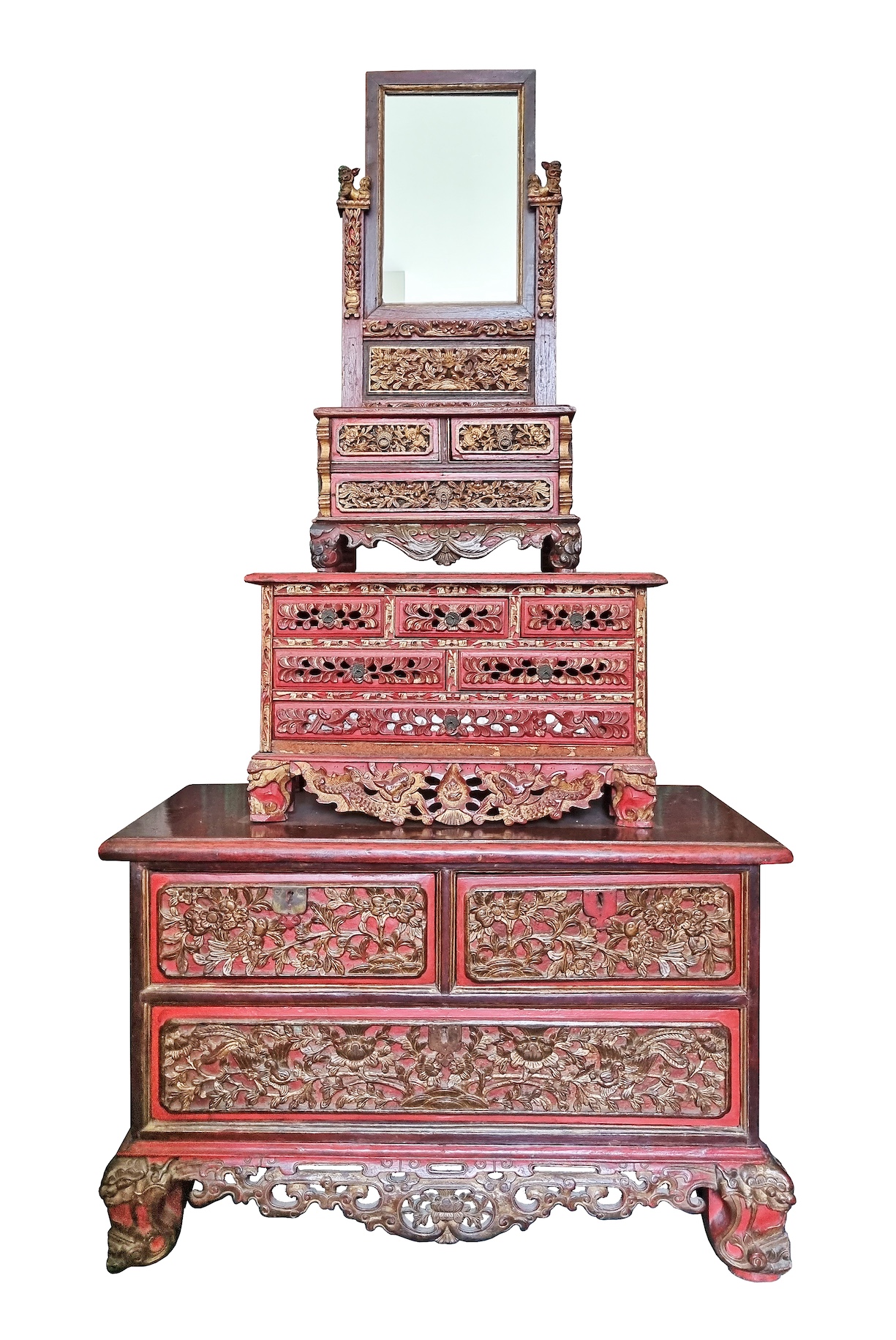 A carved teak Peranakan Chinese style red and gold chest of drawers with dressing table mirror