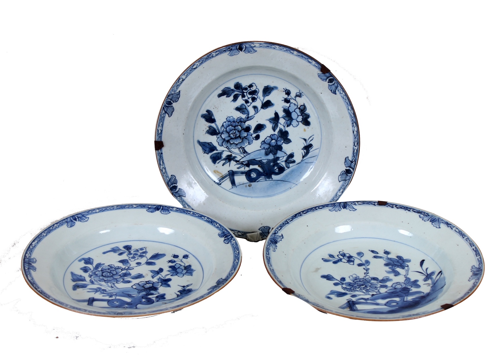 A set of three of 18th century Qing dynasty Chinese blue and white dishes painted with peonies