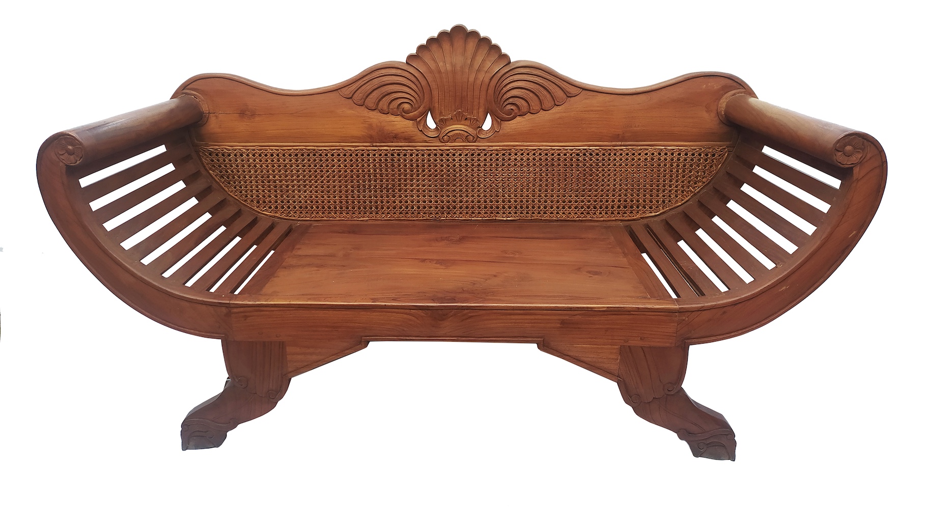 An early 20th century carved teak sofa with rattan back