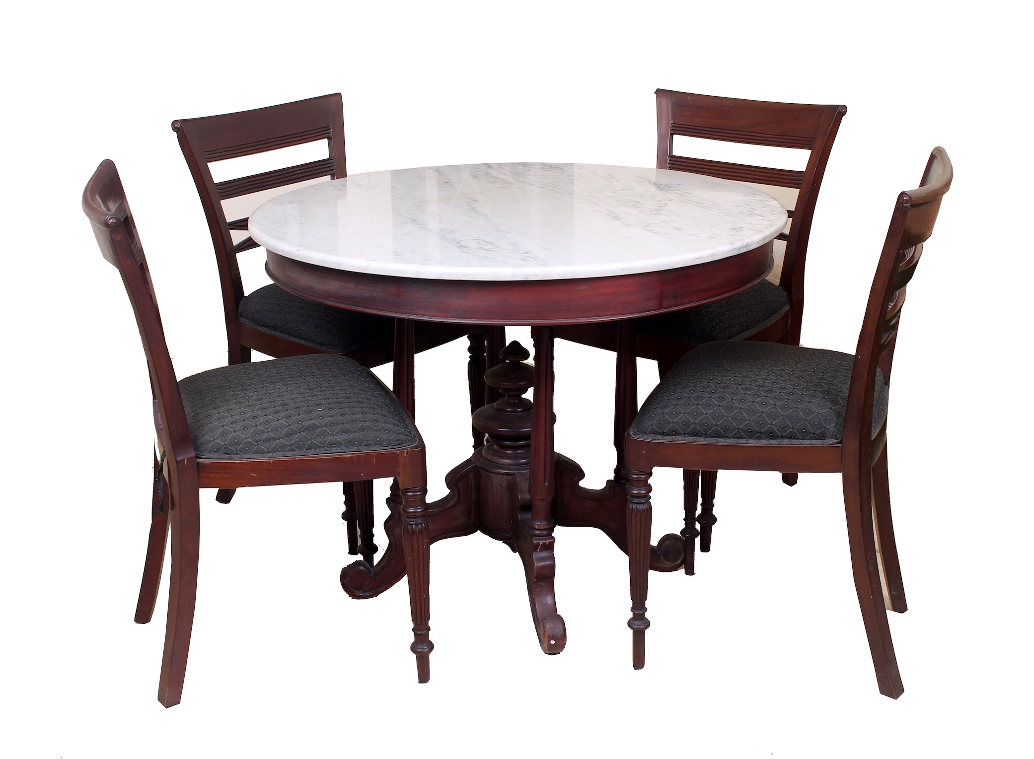 A set of carved teak of round table with marble top and four chairs