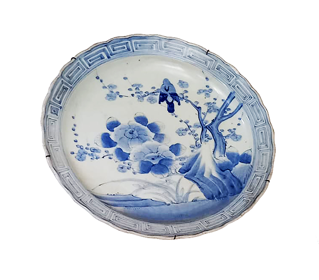 A 19th century Arita blue and white large dish painted with birds and floral