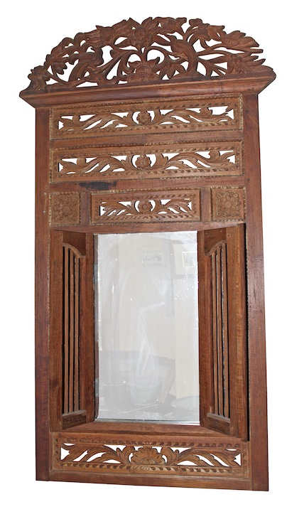 A 20th century carved teak mirror