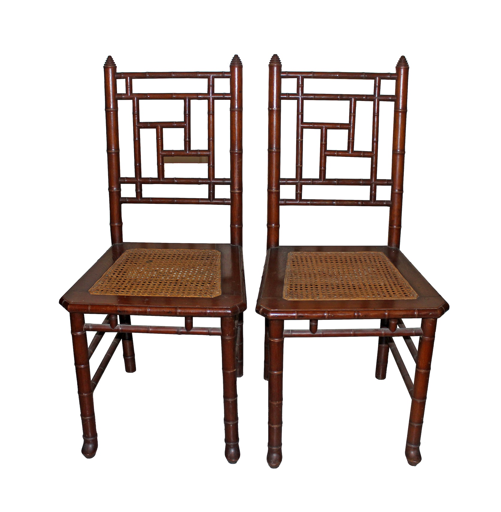 A pair of Bamboo style side chairs with rattan seat