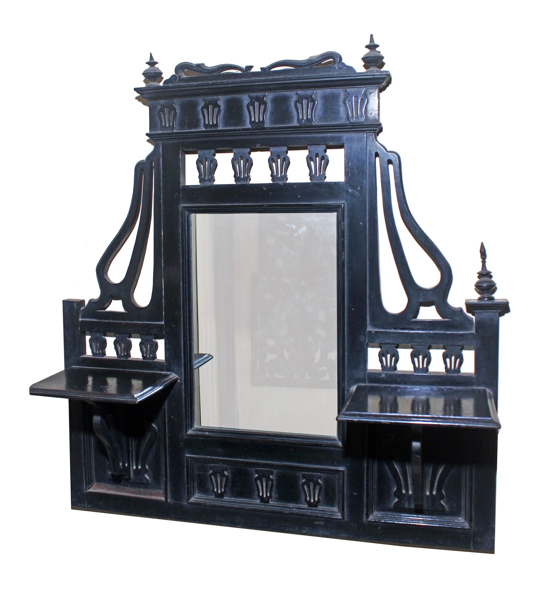 An art nouveau carved teak mirror