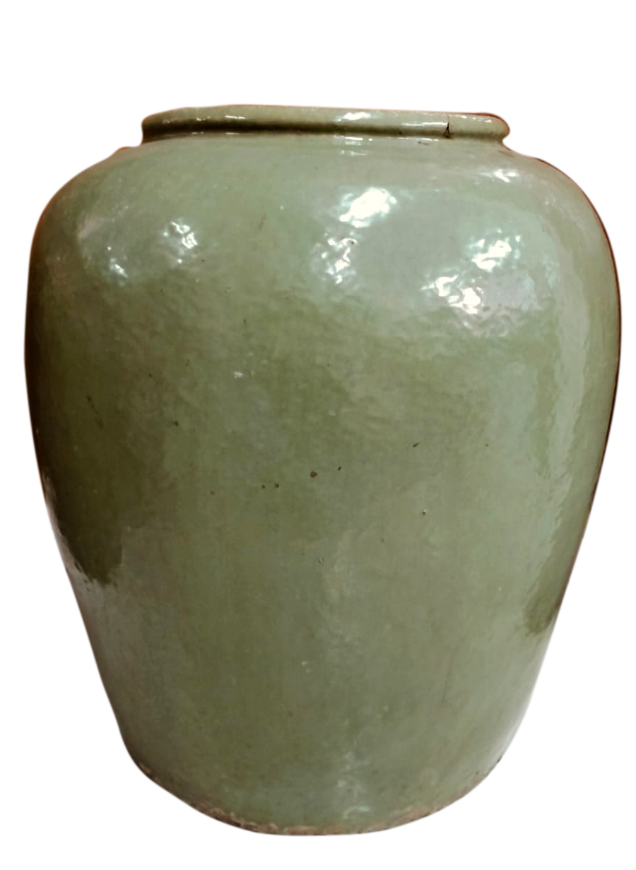 A late 19th early 20th century Chinese green glazed storage jar