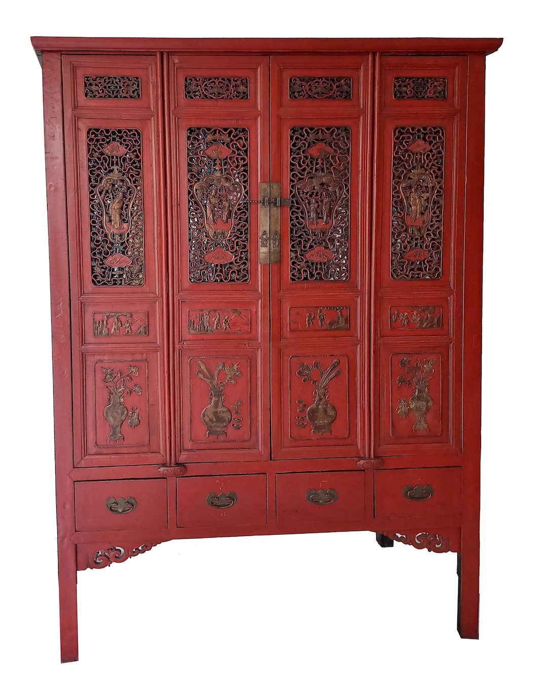 A late 19th century Chinese carved red and gold cupboard with four doors panels