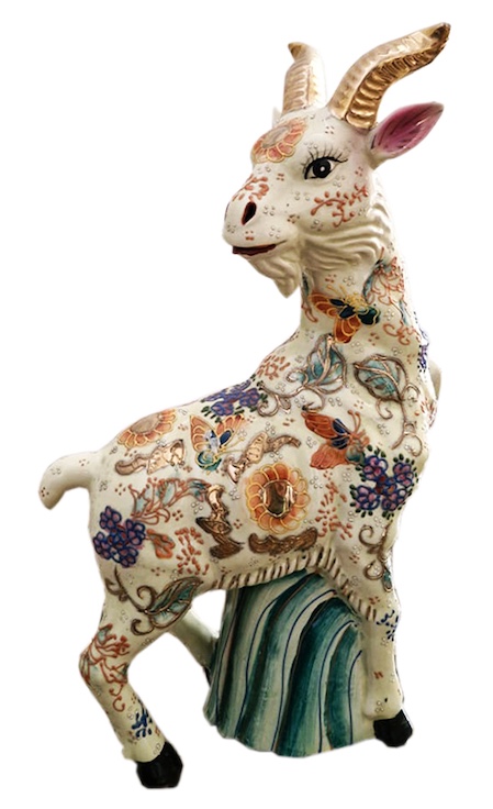 A European polychrome ceramic figurine of standing ram