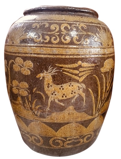 A late 19th early 20th century Chinese stoneware storage jar decorated with deer and trees