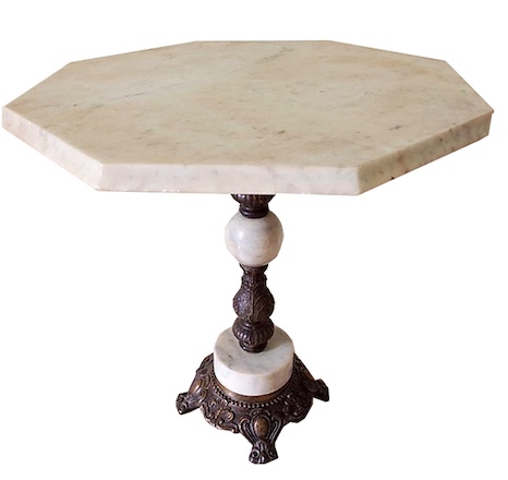 An octagonal marble table with brass mount