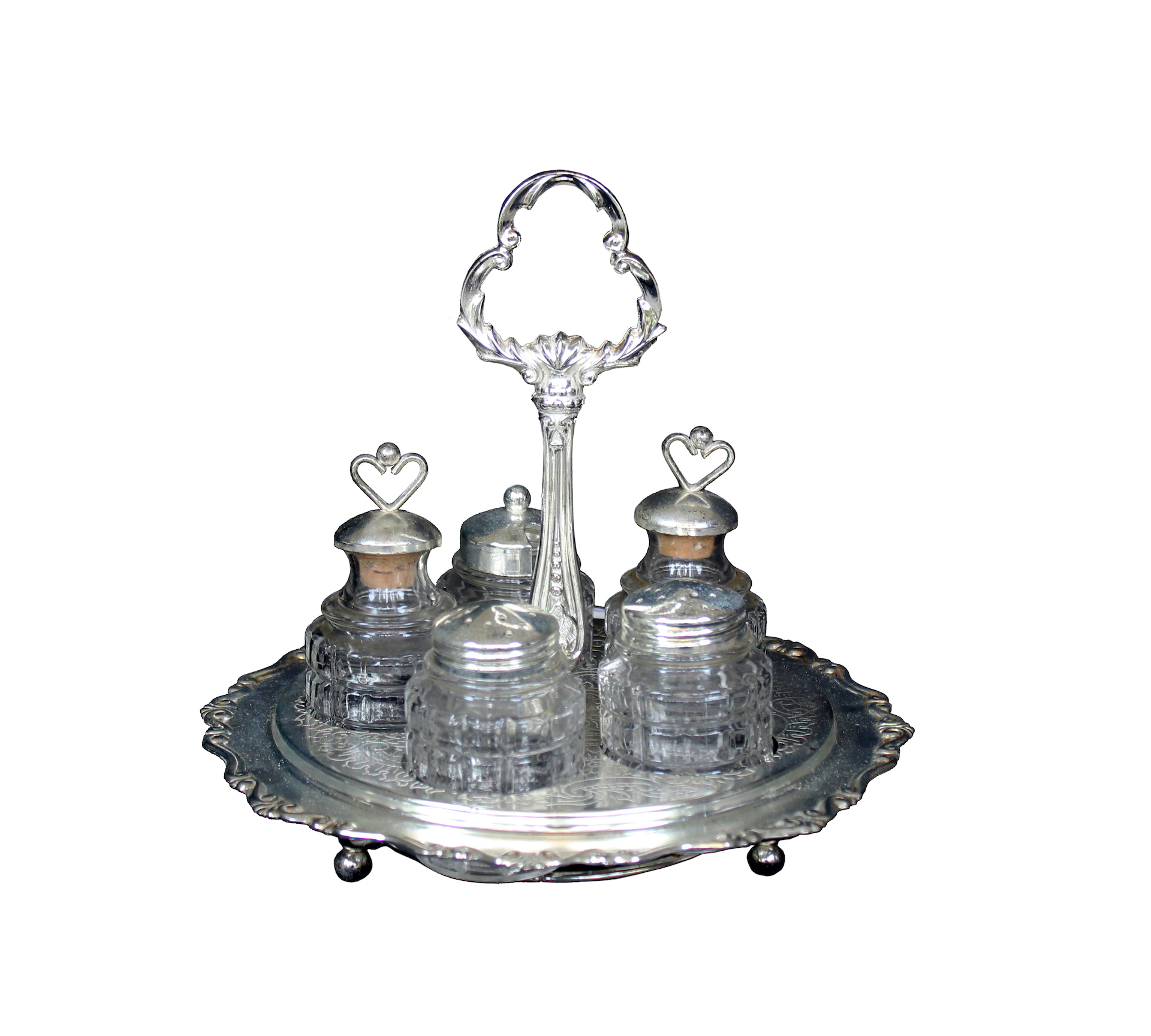 A silver plated condiment set with tray