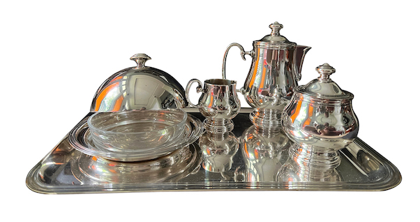 A silver plated tea set consisting of a tea pot, a sugar pot, a creamer pot, a saucer plate with cover and a tray. stamped Christofle