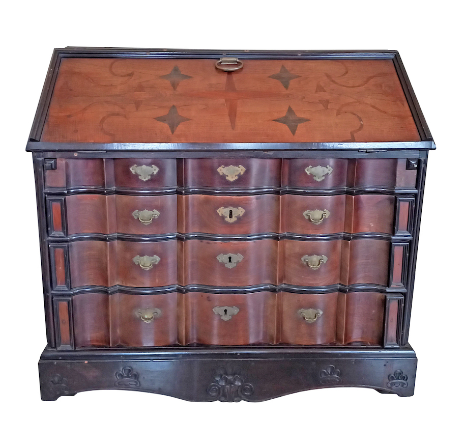 An early 20th century Dutch colonial period teakwood writing desk decorated with marquetry