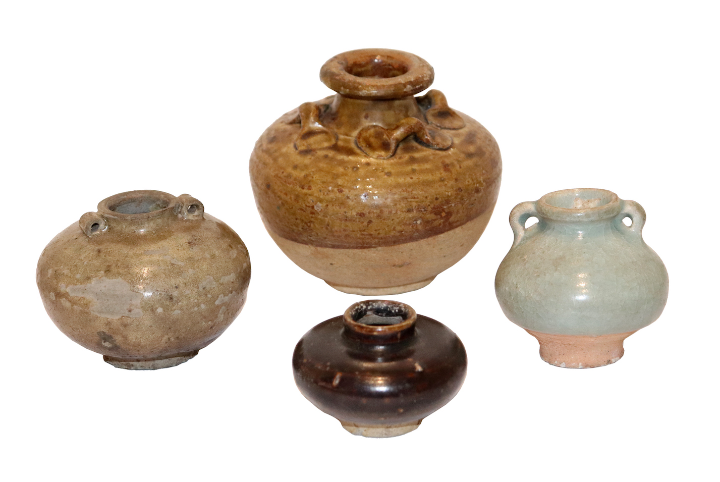 A group of four of 14 - 16th century antique jarlets consisting of a Chinese jarlet and three Thai Sawankhalok jarlets