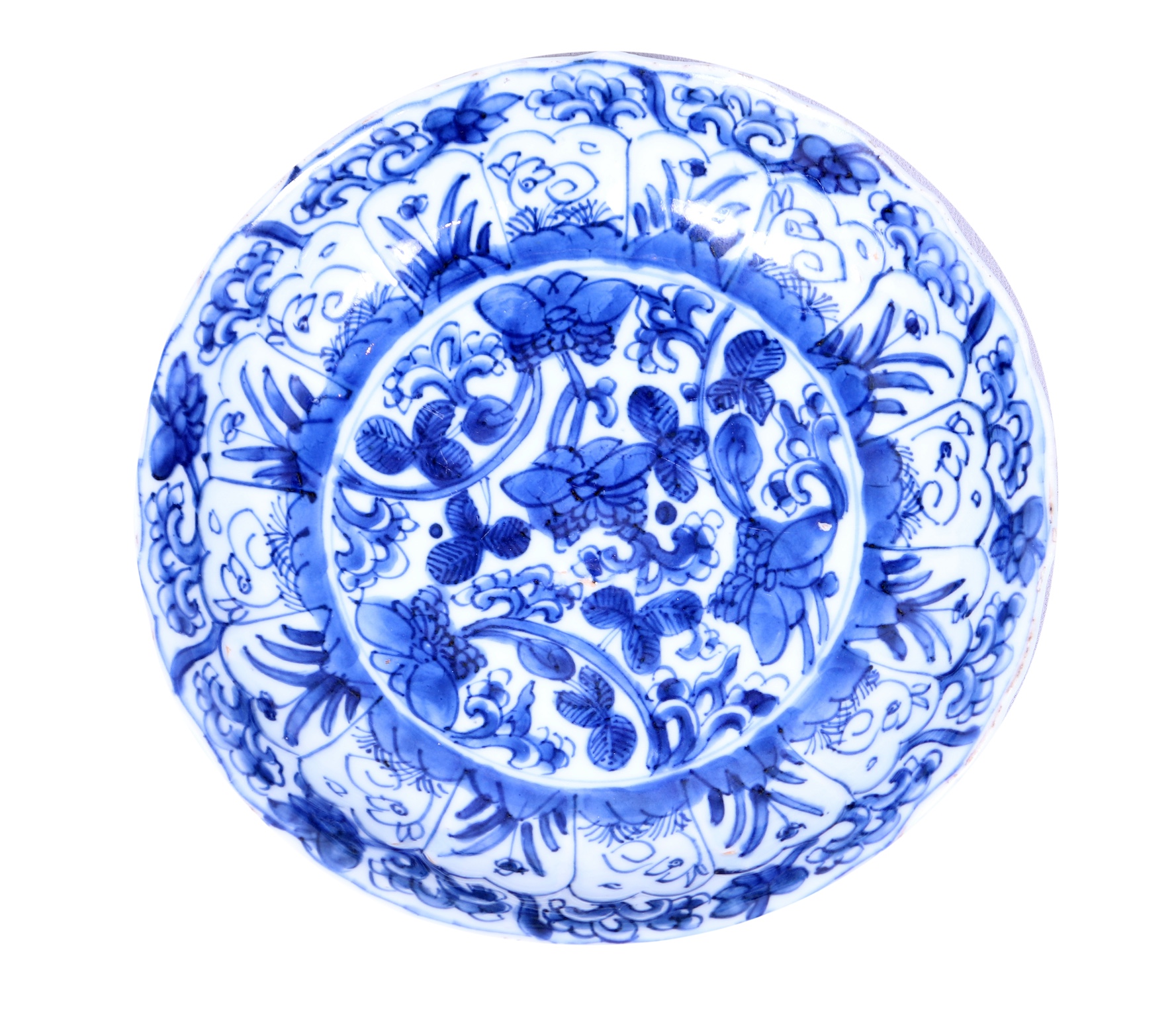A Kangxi blue and white dish painted with flower scroll and rabbits