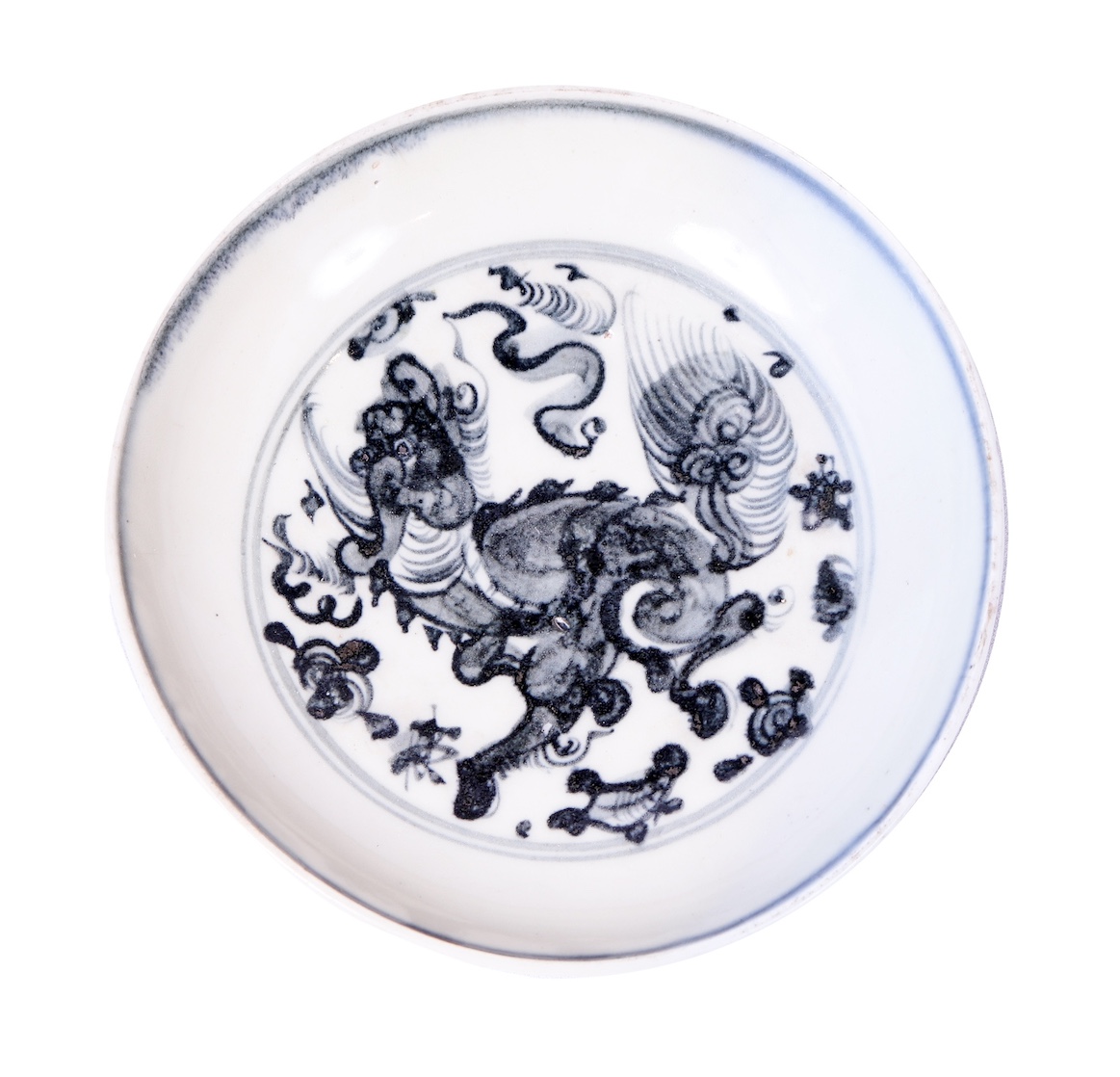 A 15th - 16th century Ming blue and white dish painted with qilin