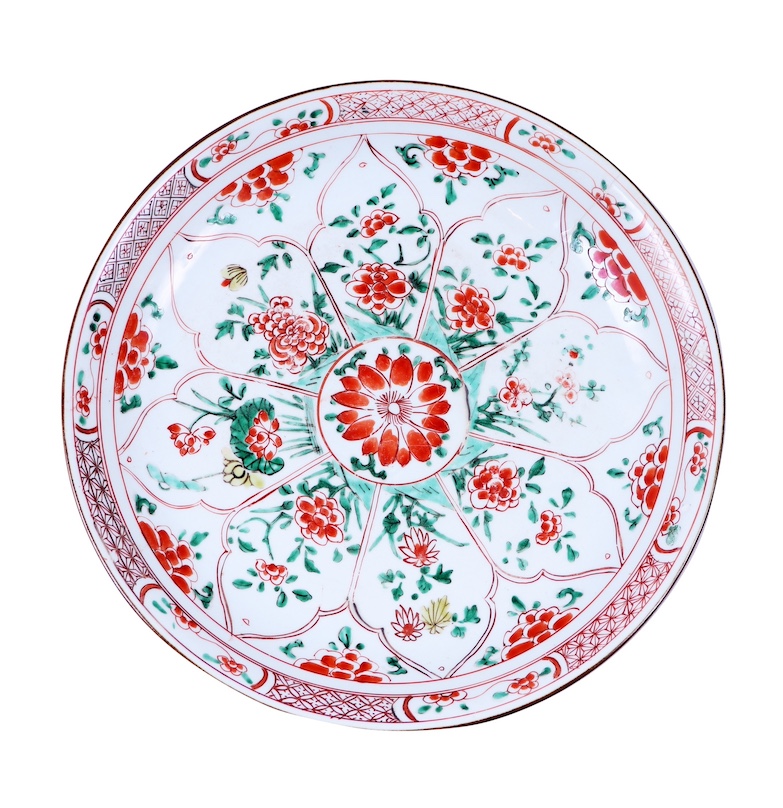A Qing 18th century Chinese famille verte and iron red dish painted with panels of flowers