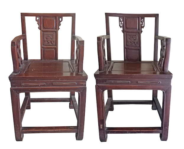 A pair of carved teak Peranakan style armchairs