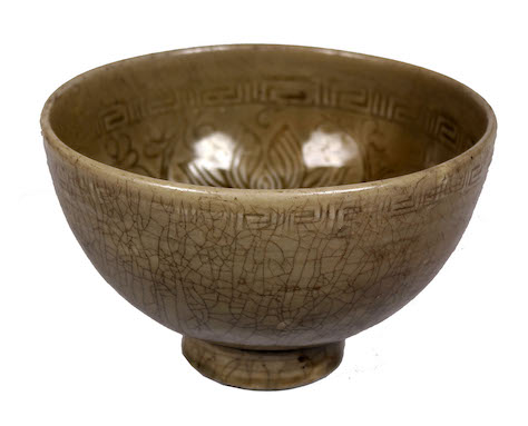 A 15th century Ming celadon impressed decorated bowl