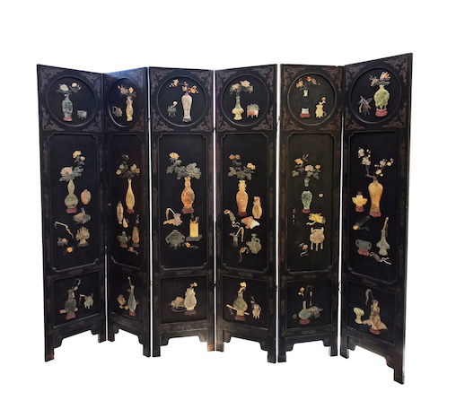 A six paneled Chinese black laquer wood floor screen decorated with soap stones