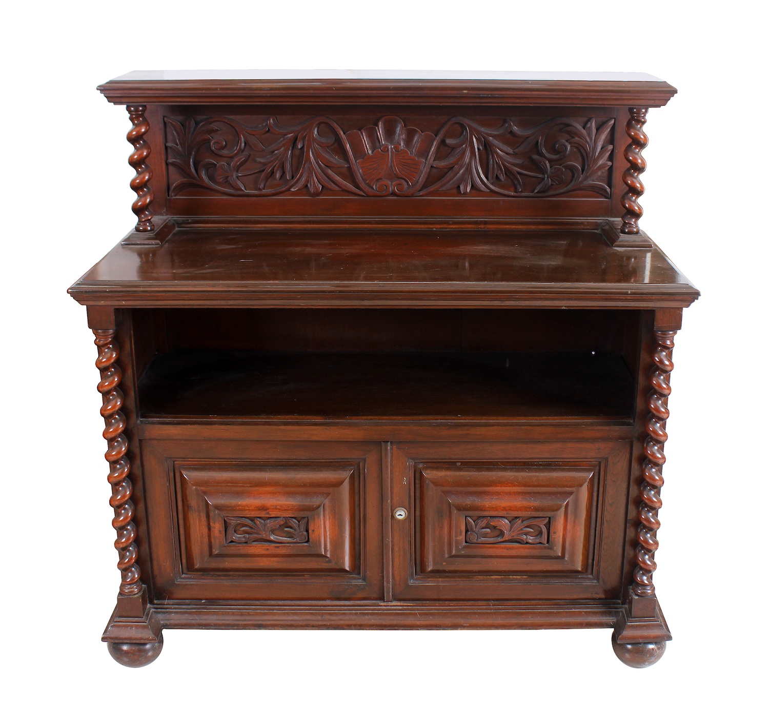 A first half 20th century carved teak Bosca style sideboard