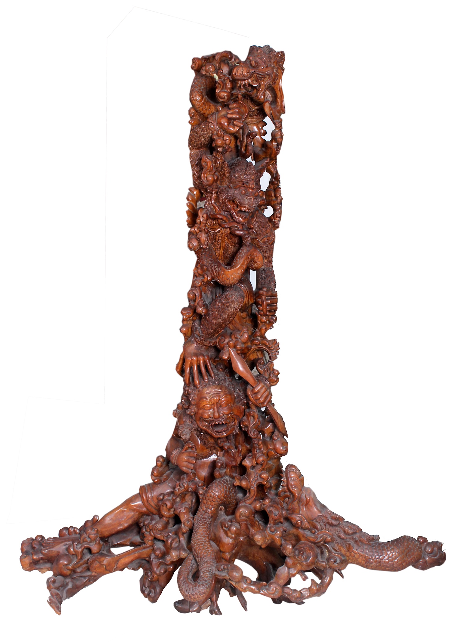 A carved wood tree with figures
