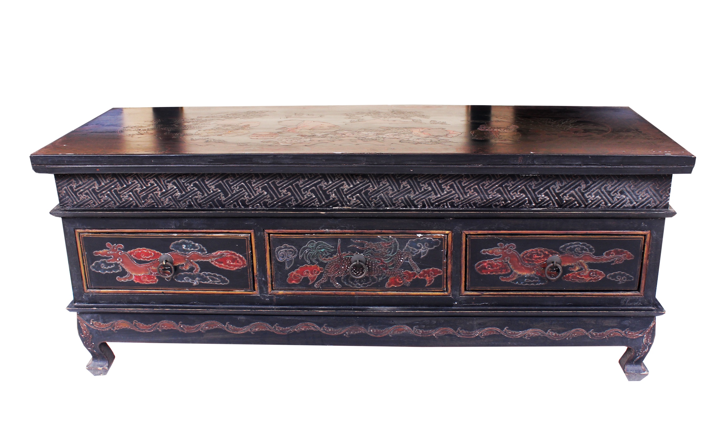 A carved teak sideboard with three drawers
