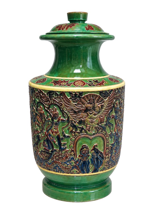 A 20th century polychrome ceramic vase with relief decoration