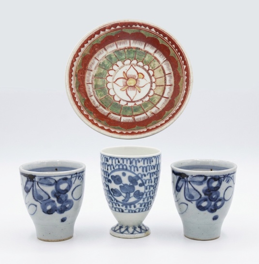 A set of four ceramic consisting of three pieces 20th century sake cups and enamelled bowl