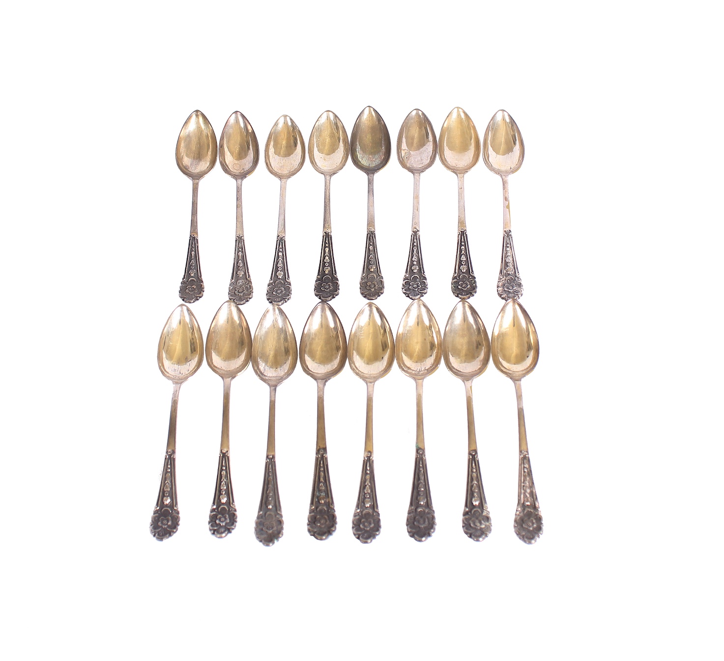 A set of sixteen silver tea spoons