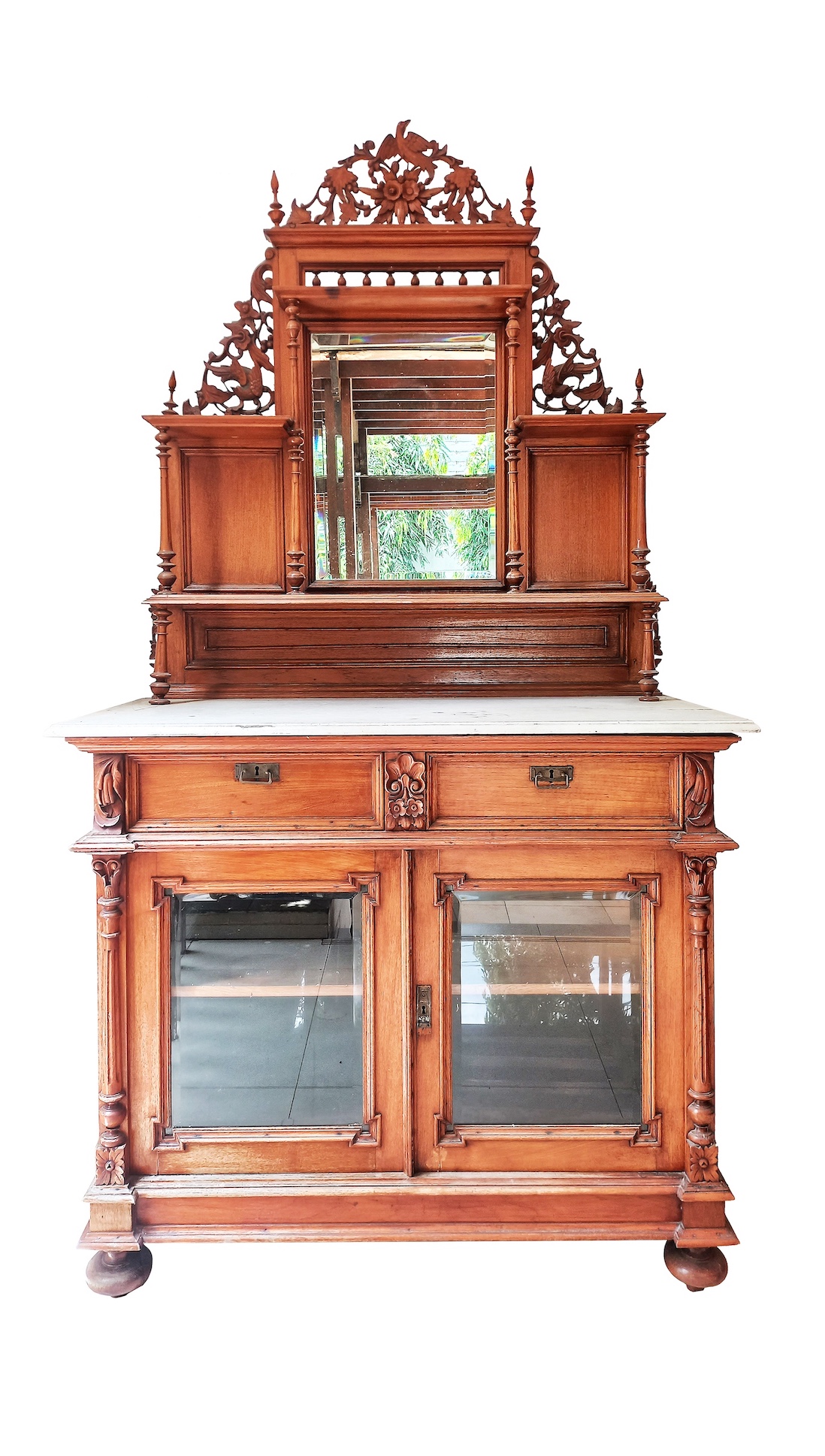 A late 19th early 20th century carved teak side board with marble top and mirror