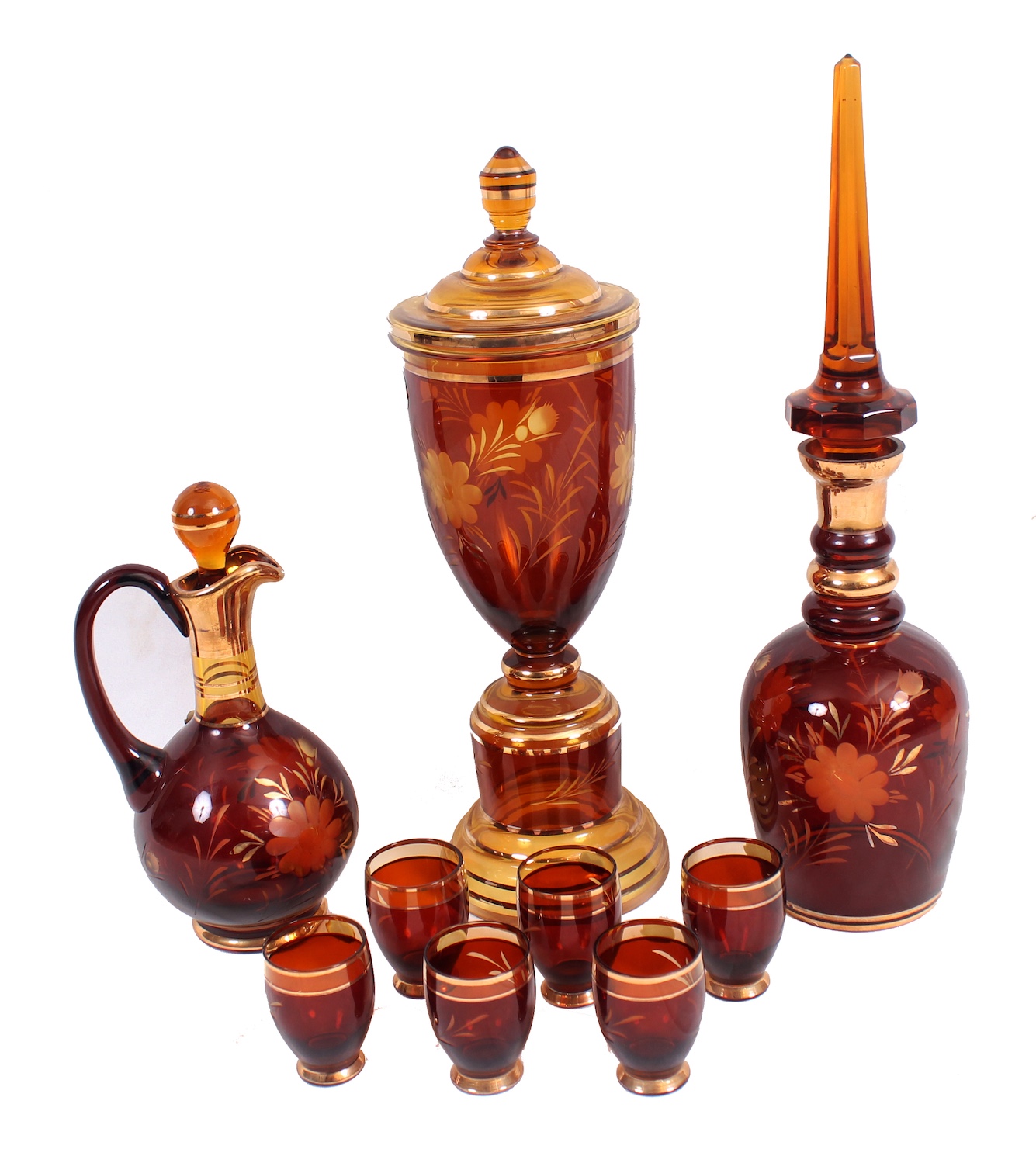 A group of nine Bohemian glass consisting of a jug, a bottle, a covered jars and six glasses